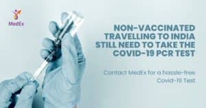 Hands holding Covid- Vaccine and Syringe