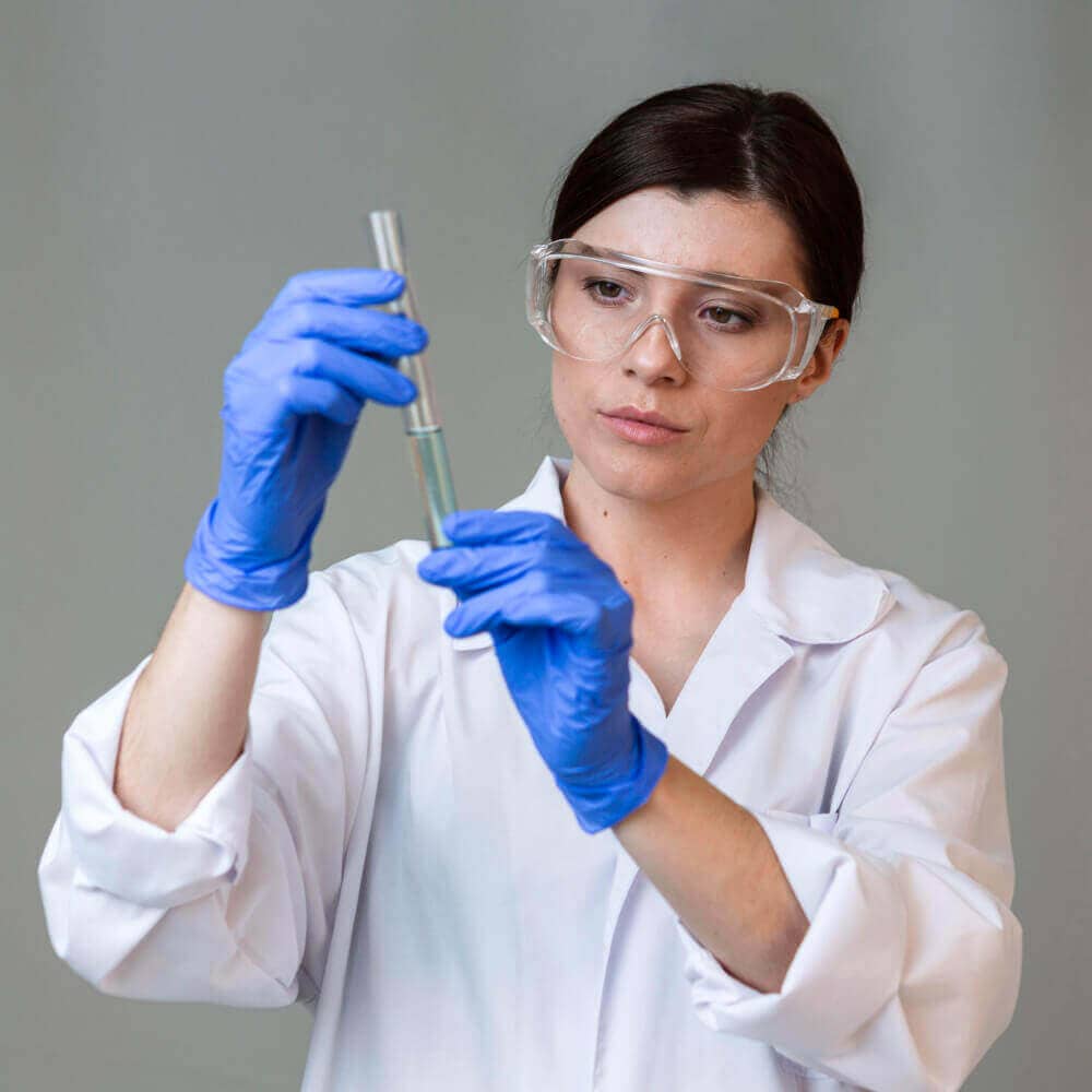 front view female researcher with safety glasses test tube 1